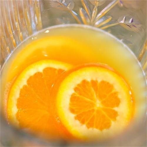 Spiced tea punch with orange slices.