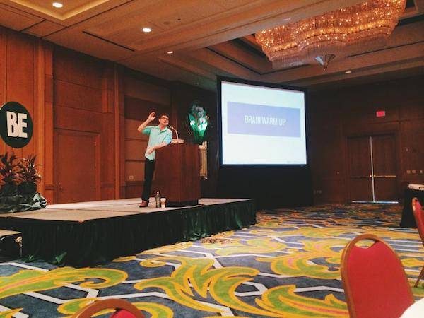 Man speaking at a conference.