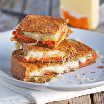 A picture of Fontina, Cheddar and Gruyère Grilled Cheese with Roasted Vegetables