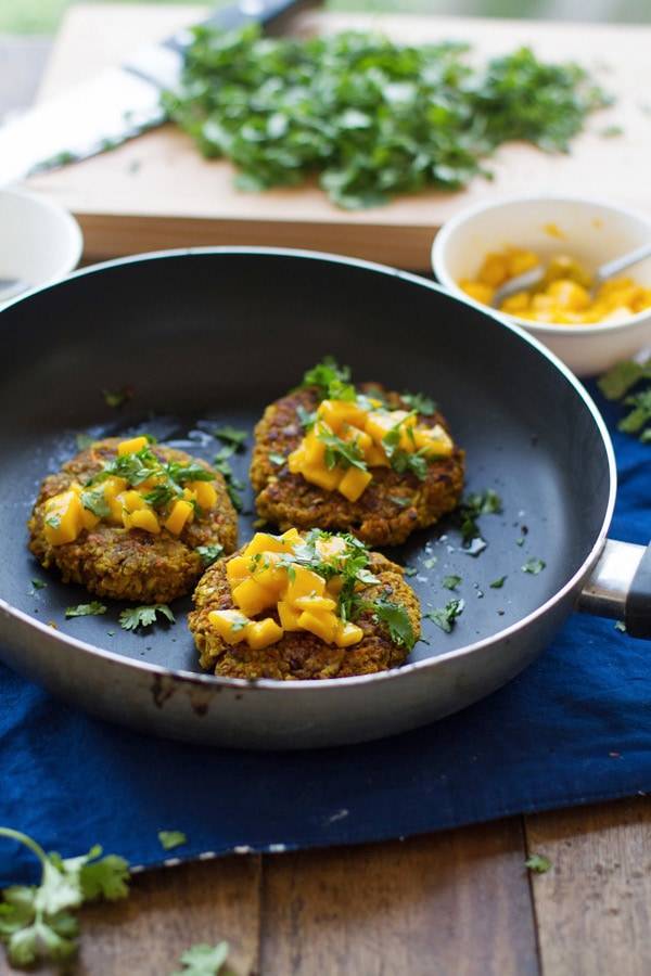 Curried veggie burgers in a skillet.