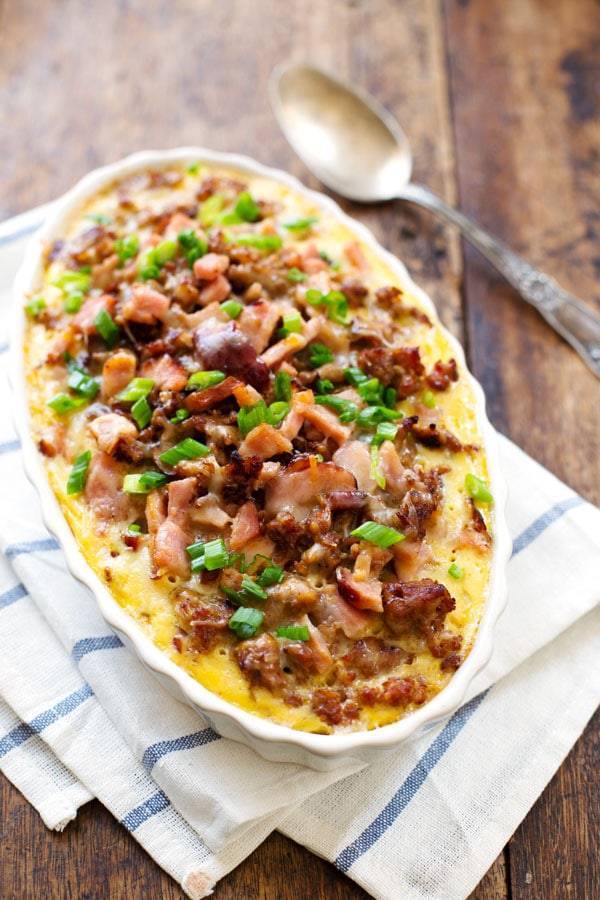 Ham and Sausage Hash Brown Egg Bake with a spoon and a napkin.