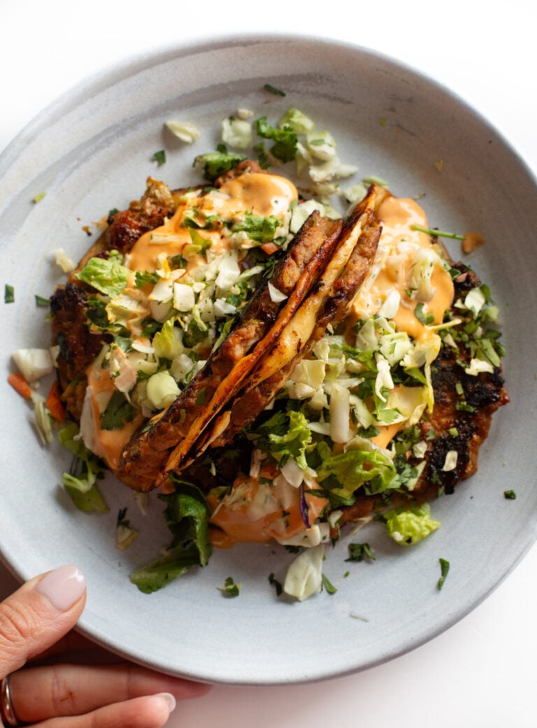 Egg roll tacos on a plate.