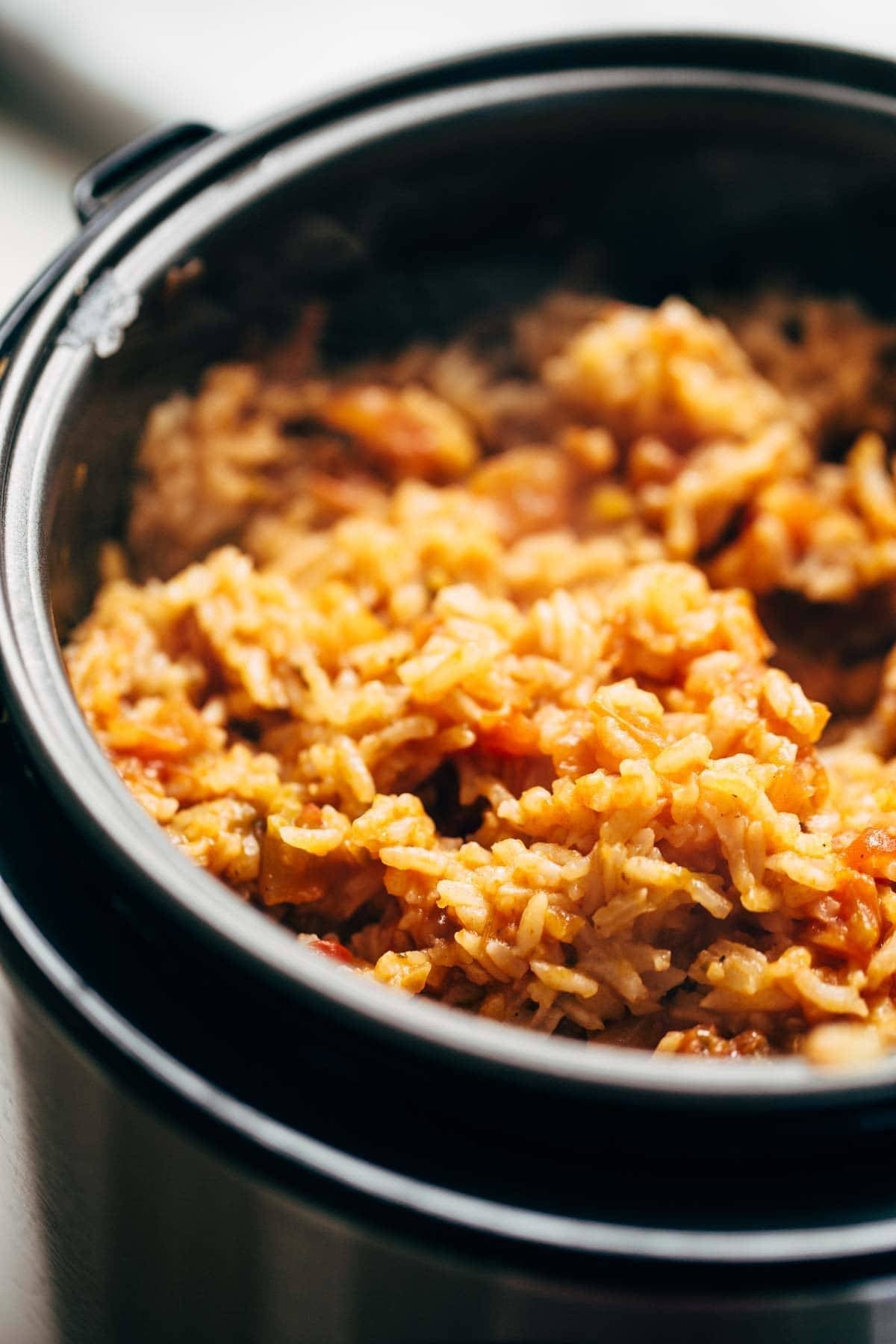 Spicy Brazilian Burrito Bowls recipe featuring seasoned rice and beans, garlic cilantro lime slaw, and crispy fried plantains. So good // almost vegan. | pinchofyum.com Spicy Brazilian Burrito Bowls recipe featuring seasoned rice and beans, garlic cilantro lime slaw, and crispy fried plantains. So good // almost vegan. | pinchofyum.com