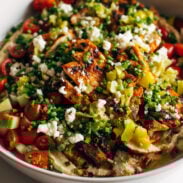 Grilled chicken with pepperoncini garlic butter on a platter